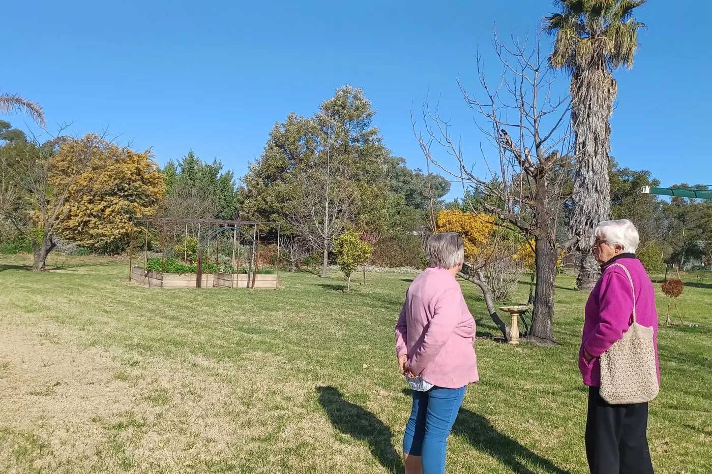 Warm, sunny weather encouraged members to take a pleasant walk around Jan\\u2019s extensive grounds and well-kept gardens.