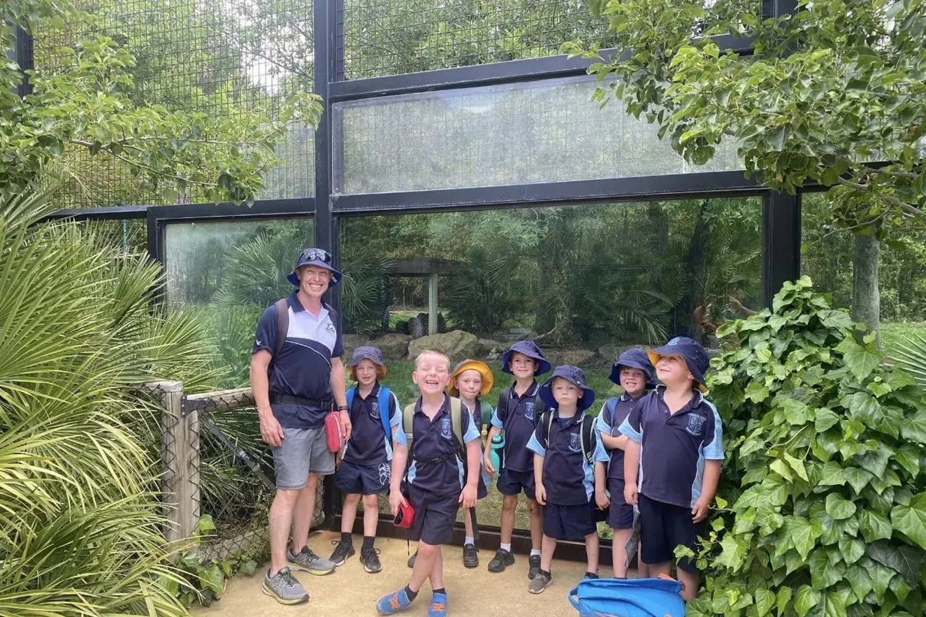 Mr Kilby with students Tully, Billy, Daniel, Ethan, Jaxson, Cohen and Lewis near the tigers. PHOTO: Supplied