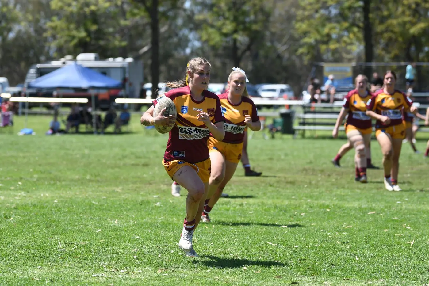 Caitlin Dixon runs downfield supported by team mates. PHOTO: File