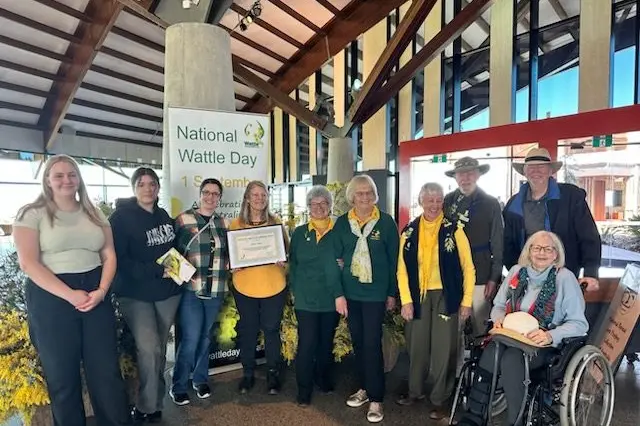 Mikla Lewis with family and Wattle Day Association members