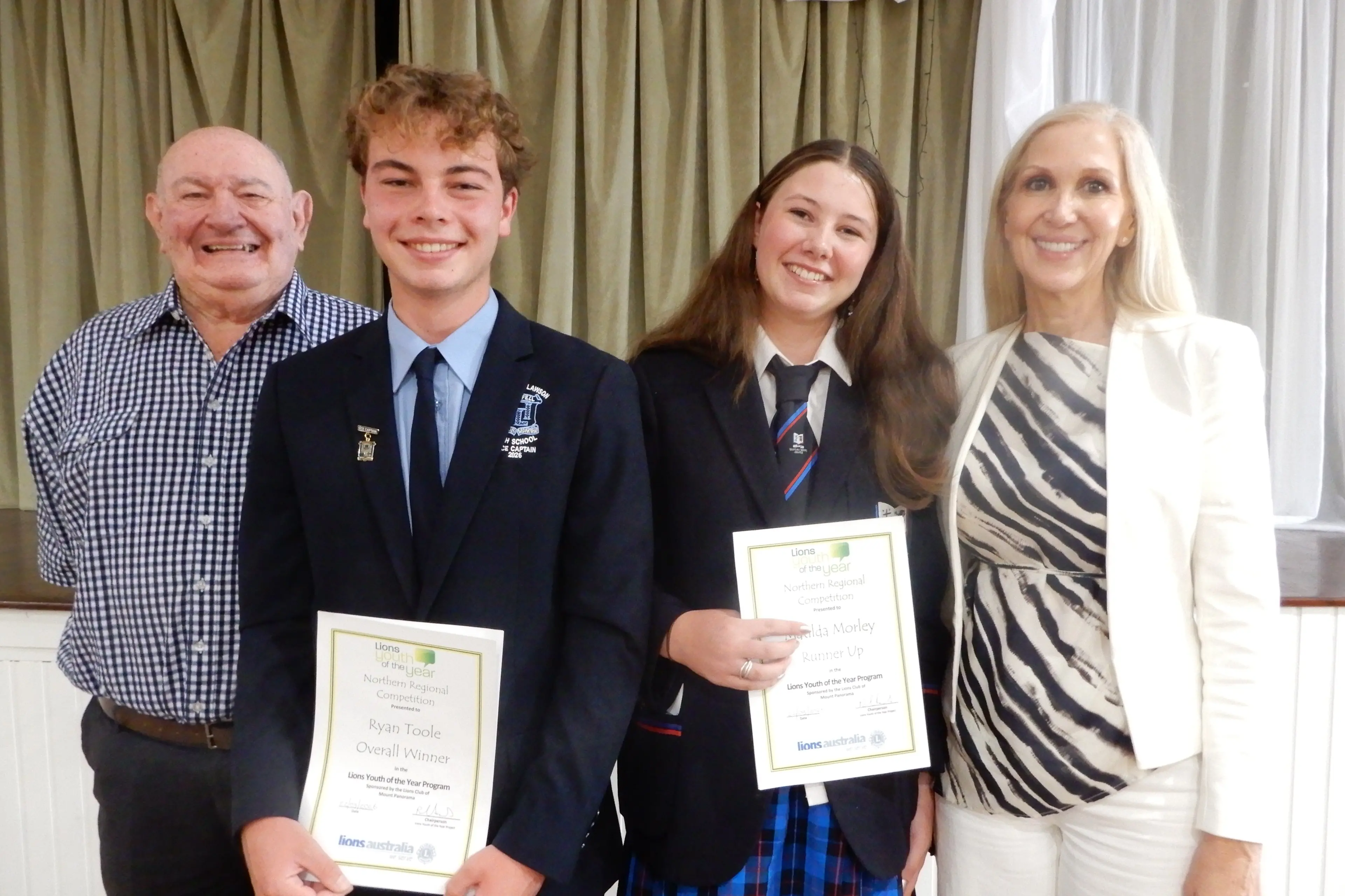 <p>Public Speaking winner Ryan Toole and Runner Up Matilda Morley were presented with their certificates from Judges PDG Lion Tony Smith and Yvette Simunic.</p>\\n