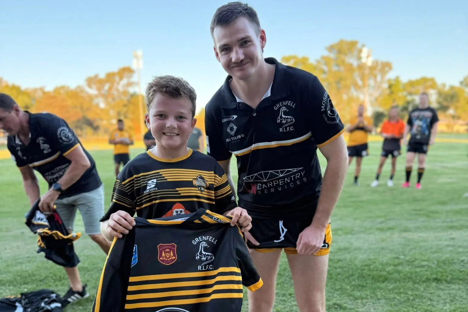 <p>Junior Goanna Nixon Hewen presents Frazer Ryder with his first grade jersey at the Goannas first trial match of the season against West Wyalong Mallee Men.</p>\\n