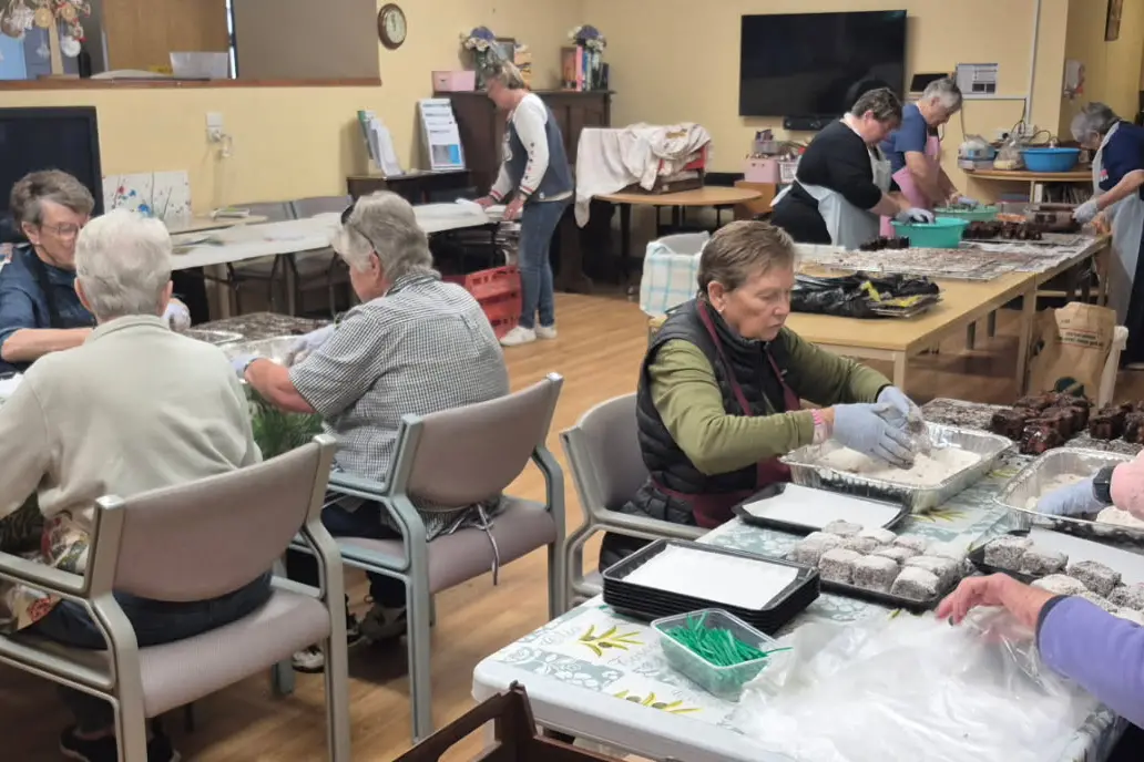 <p>Ladies busy making lammingtons.</p>\\n