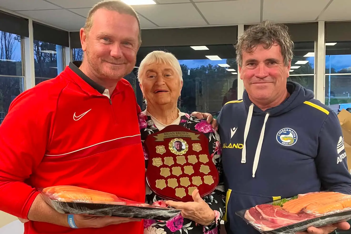 <p>Chris Cartman and Ross Brenner were the winners of the Brian Brown Memorial Golf Day, they are pictured with Helen Brown.</p>\\n