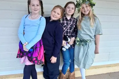 <p>Jessica, Octavia, Annabelle and Jordan were dressed up for Recitation Day.</p>\\n