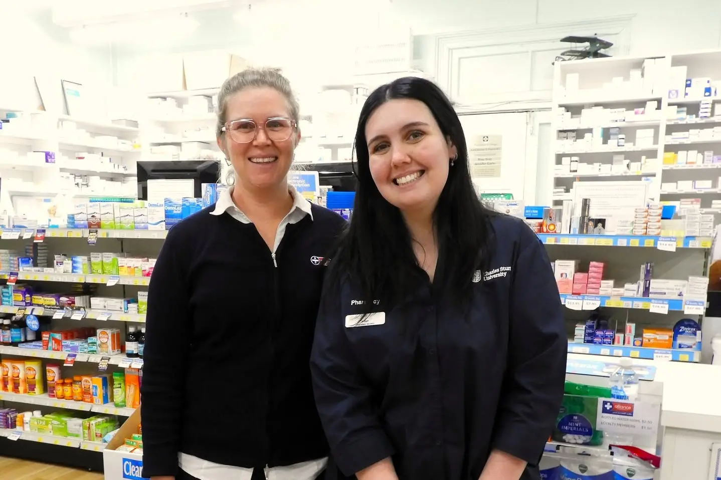 <p>Bridget Baker who is studying a Bachelor of Pharmacy at Charles Sturt University on prac at the Grenfell Pharmacy with Pharmacist Anna Brenner. PHOTO: CEF Grenfell</p>\\n
