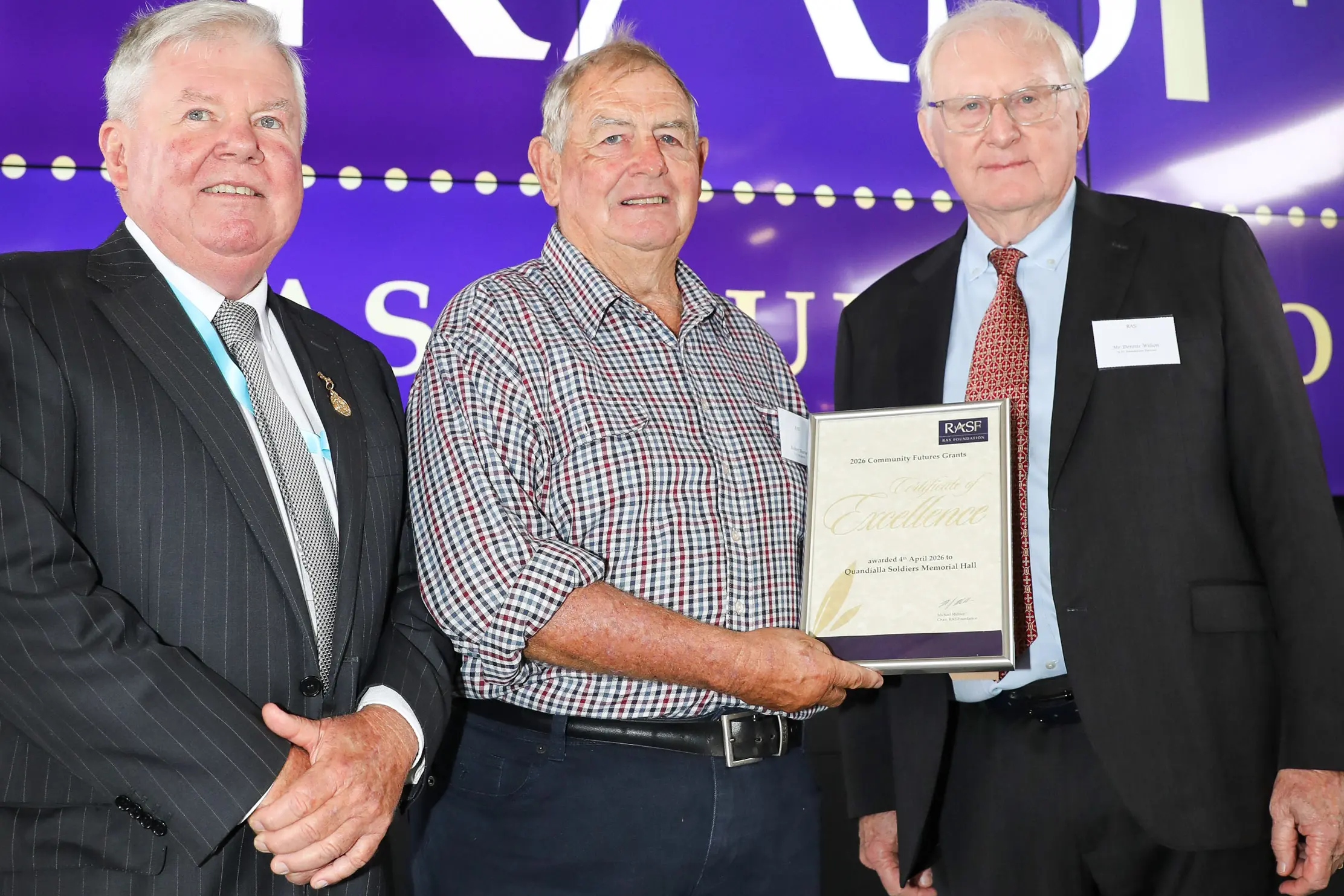 <p>Mr Michael Millner, Chair RAS Foundation, and Mr Dennis Wilson, Patron RAS Foundation present Quandialla Memorial Hall president Robert Reeves with the grant funding. PHOTO: MONDE Photo</p>\\n