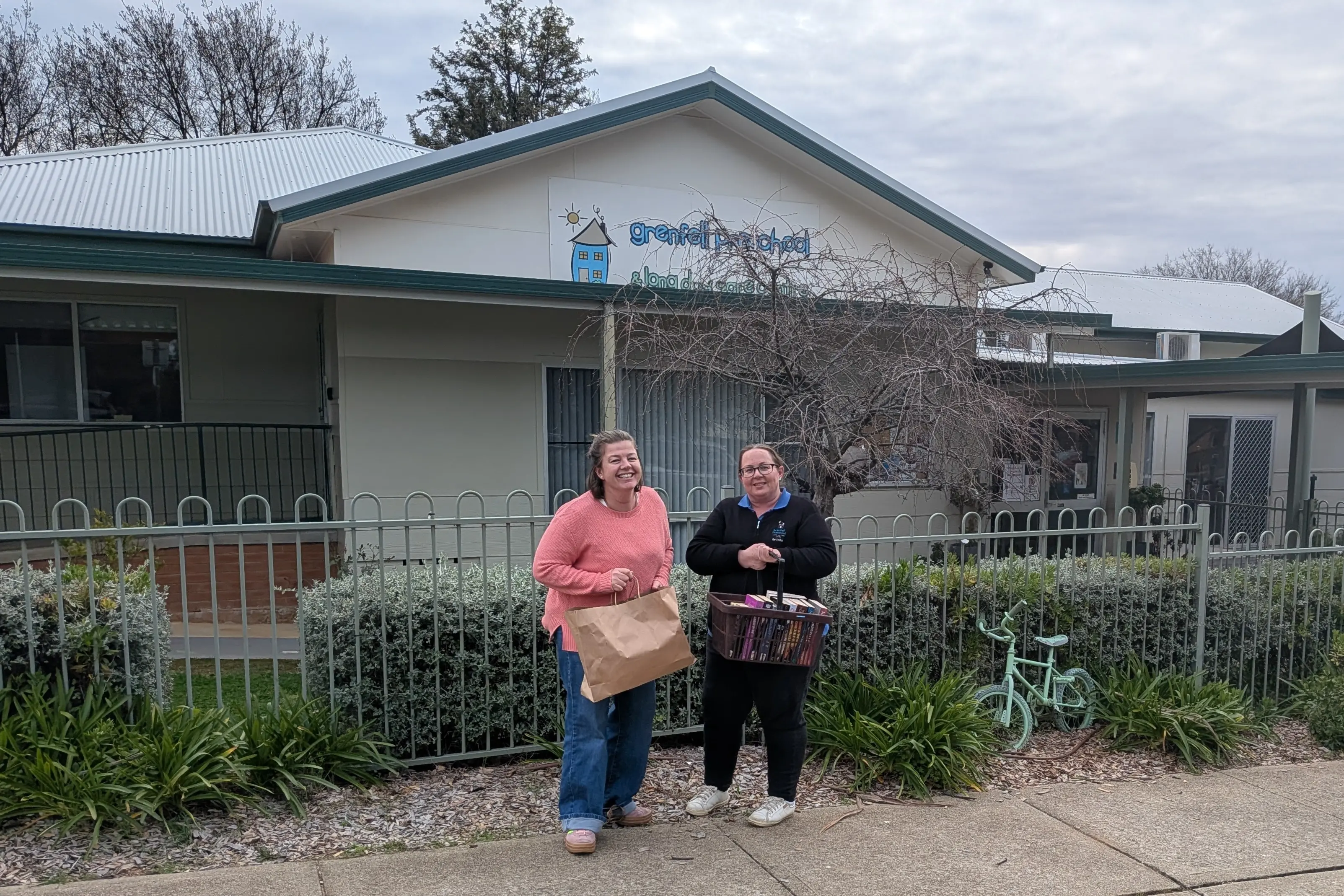 <p>Fundraiser committee member Paige Martens with Grenfell Preschool and Long Day Care acting director Belinda Muldoon with some of the books that have been donated for the second-hand book sale on 29 and 30 August.</p>\\n