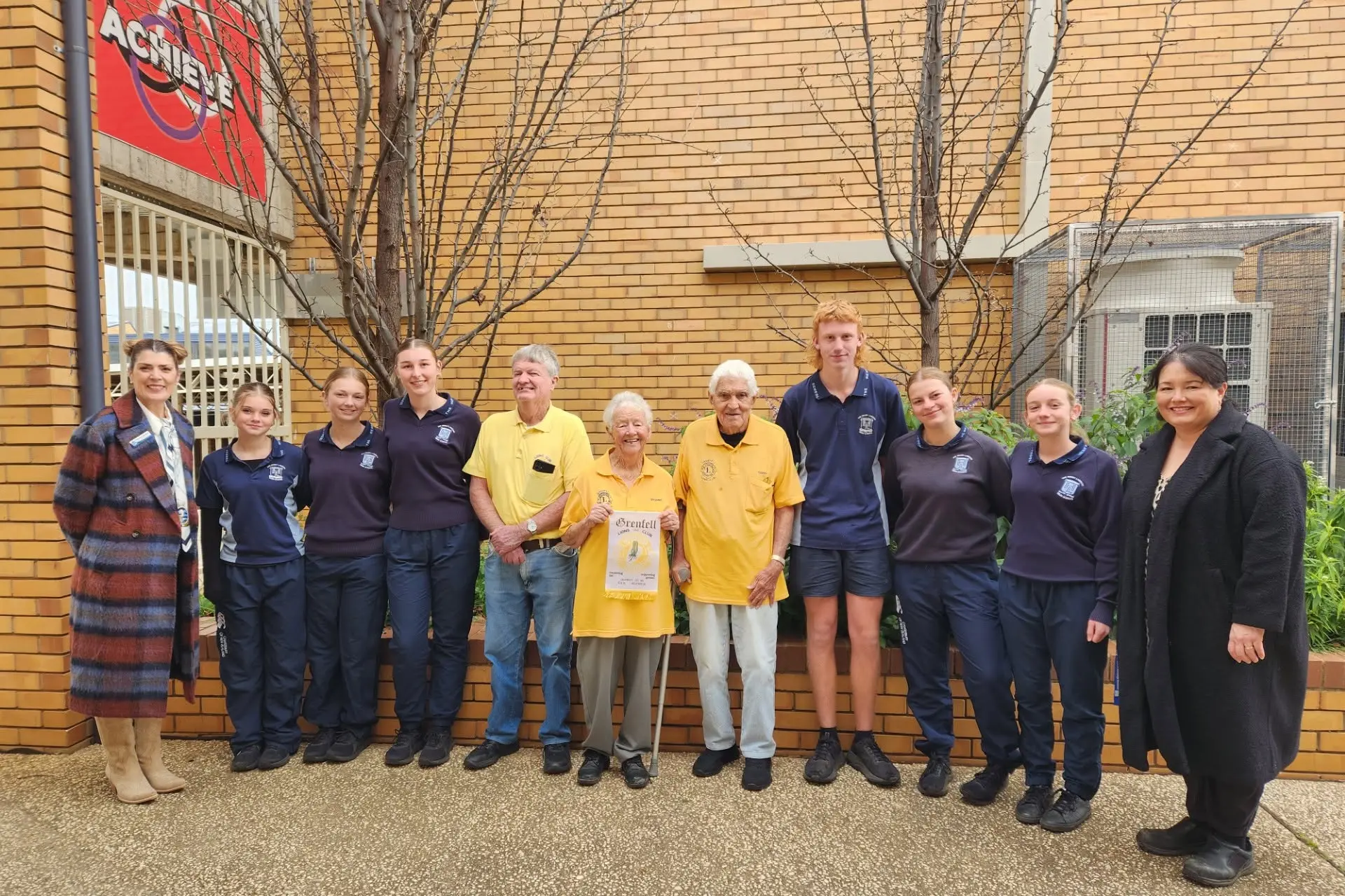 <p>Rodney, Deidre and Terry representing the Grenfell Lions Club presenting students and teachers from The Henry Lawson High School with $1500 to put towards their trip to Uluru. PHOTO: The Henry Lawson High School </p>\\n