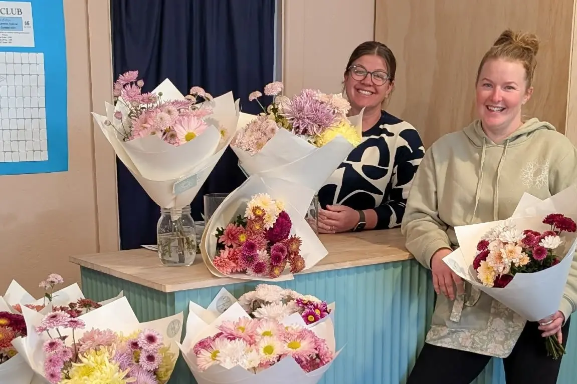 <p>The Tin Cupboard owner Paige Martens of Elyse McKnight of Paper Daisy Studio who sells her flowers in The Tin Cupboard. PHOTO: The Tin Cupboard</p>\\n