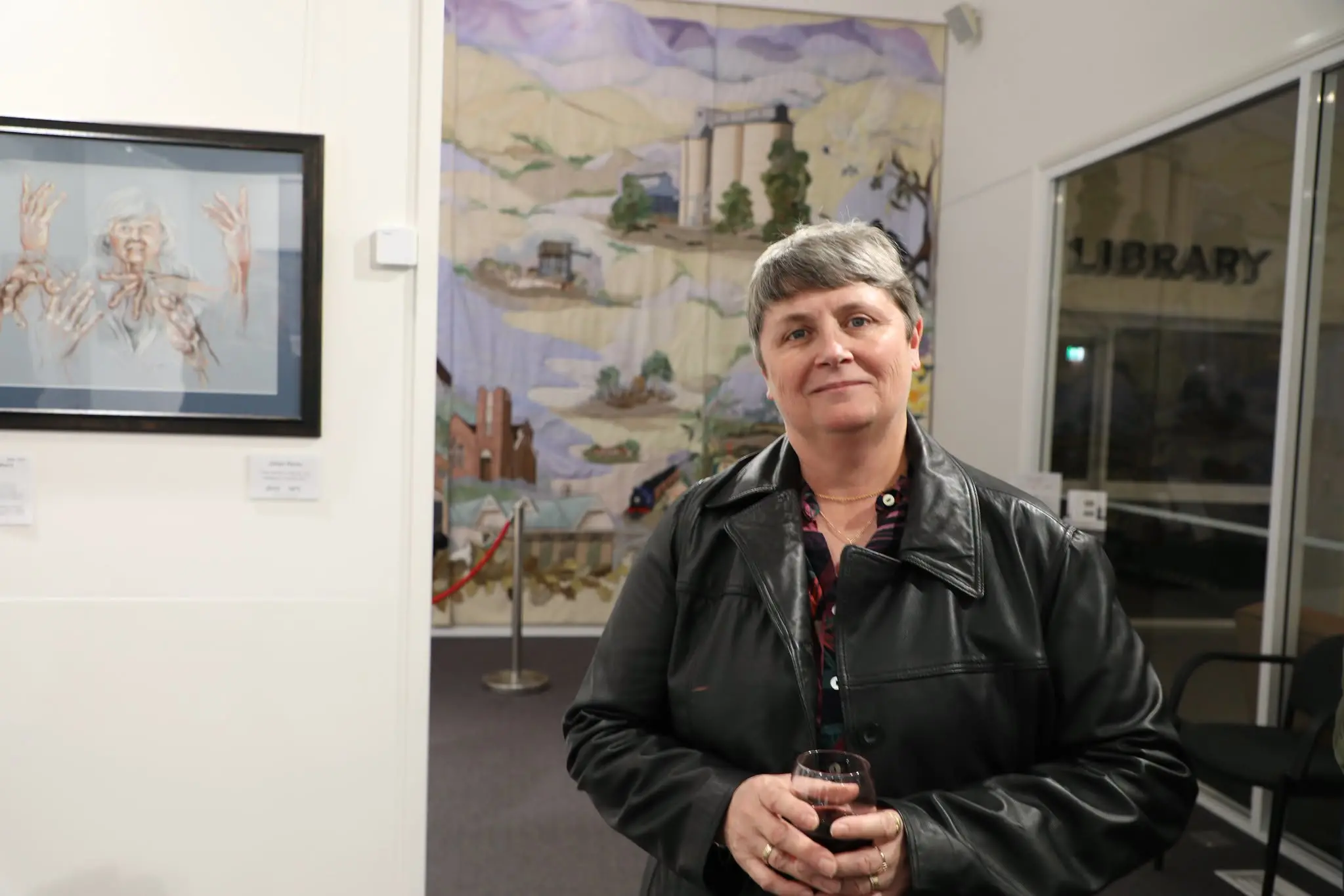 <p>Jillian Reidy at her \\'A Work in Progress\\' exhibition opening night at the Grenfell Community Hub. PHOTOS: Weddin Mountains Region</p>\\n