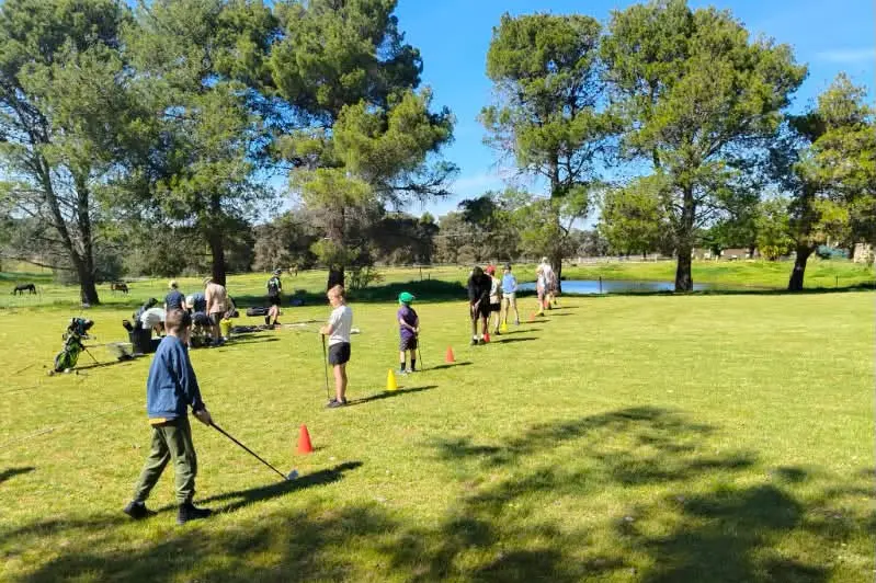<p>Eighteen junior golfers learning some new skills off PGA Professional James Hundy from Cowra Golf Club. PHOTO: Grenfell Country Club </p>\\n