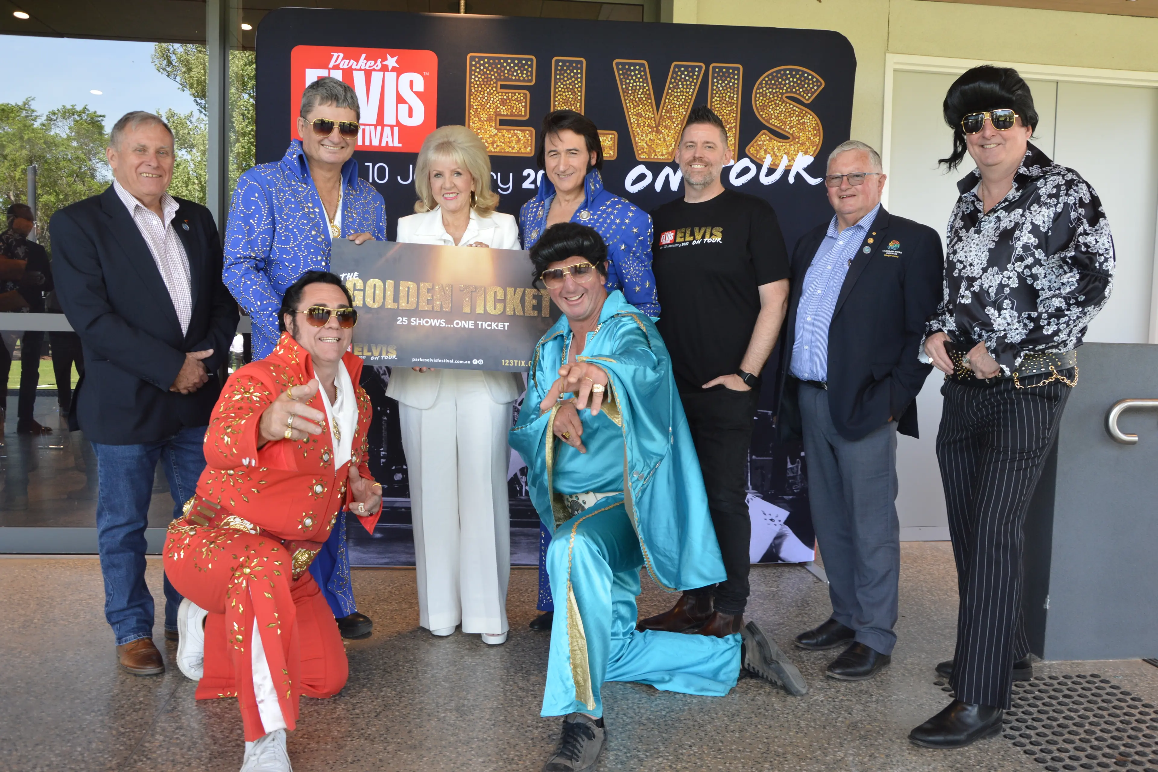 <p>At the Parkes Elvis Festival program launch with the Golden Ticket, Forbes deputy mayor Chris Roylance, Parkes Mayor Neil Westcott, Parkes deputy mayor Joy Paddison, ETA Paul Fenech, Elvis Festival director Brendan Shipley, Lachlan Shire Mayor John Medcalf OAM, and Parkes Shire Council director Anthony McGrath; front, Tony Mrak and Dooley Thompson. PHOTOS: Christine Little</p>\\n